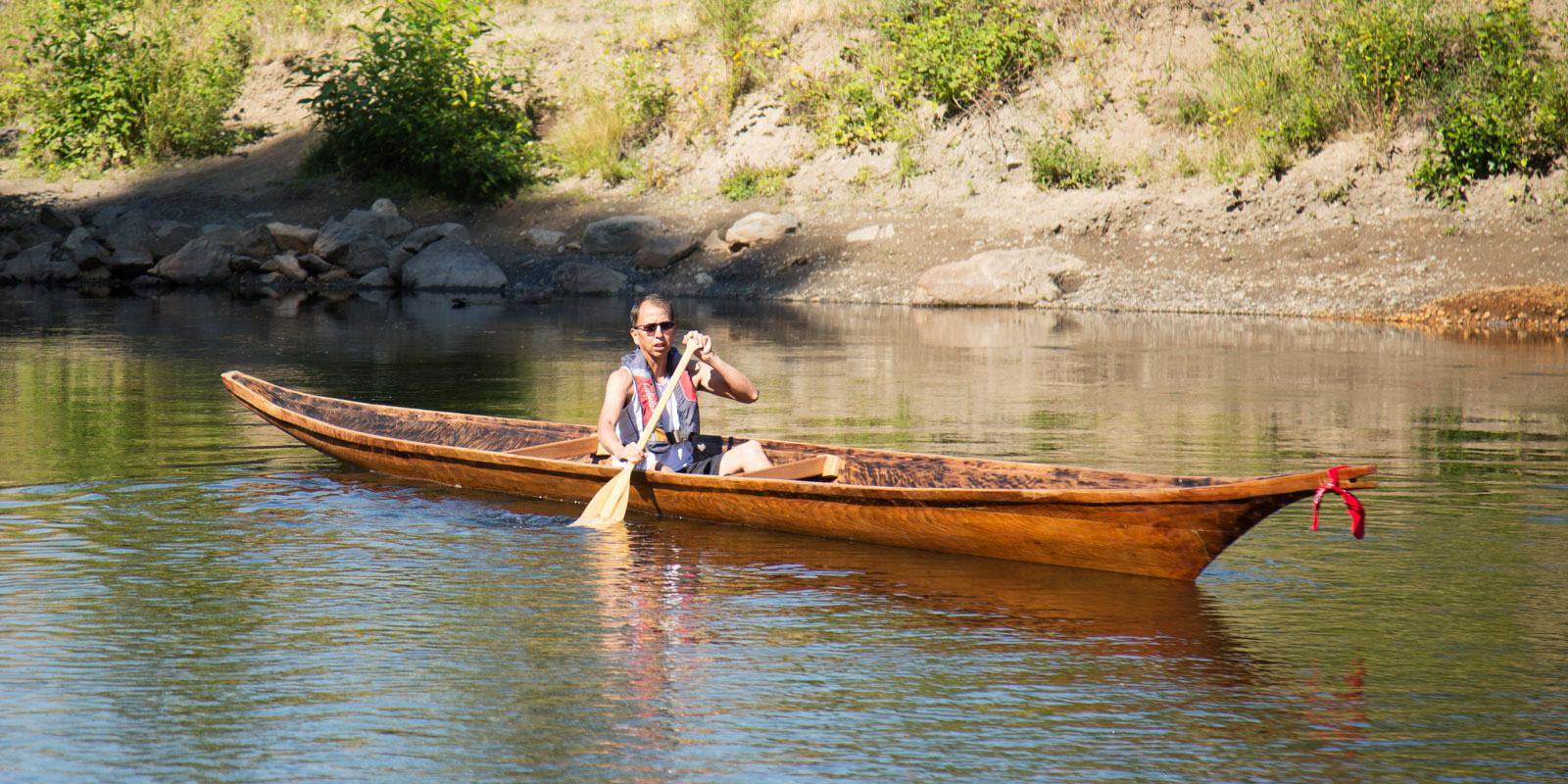 Muckleshoot Tribal Historian Warren KingGeorge paddles the s.dəxʷìł in the Green River.