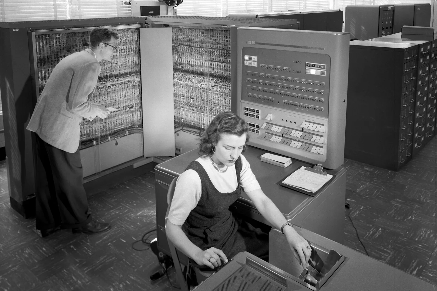Using an IBM 704 computer at NACA (National Archives/NASA)