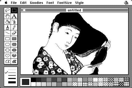 A picture in MacPaint 1.0, drawn by Susan Kare. The image is an adaptation of a 1920 woodblock print by Hashiguchi Goyo, which shows a young woman combing her hair. 