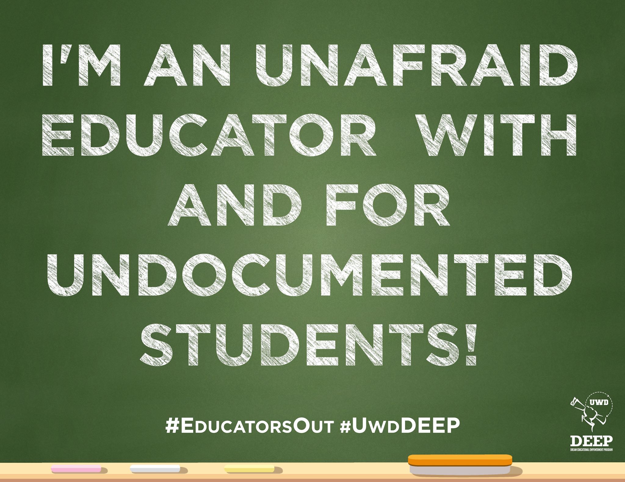 Chalk board that says "I'm an unafraid educator with and for undocumented students!"